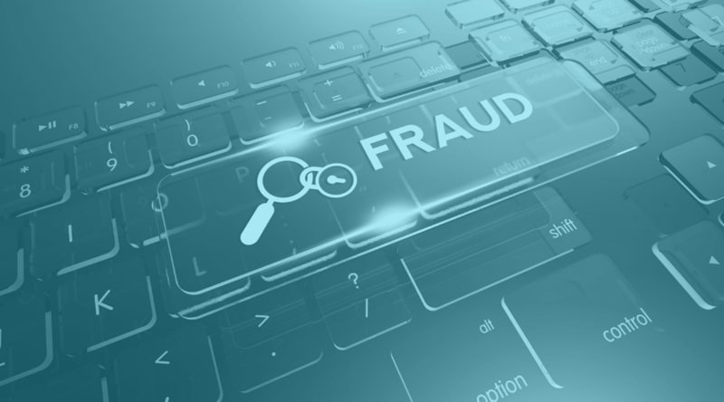 Keyboard with the word FRAUD on one key